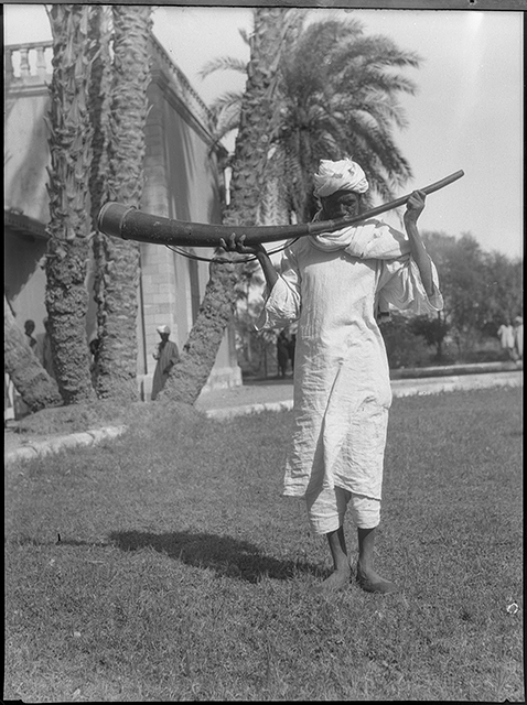 Man sounding a war trumpet