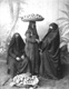 Click to see details of three veiled women dressed in dark...