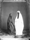 Click to see details of two veiled girls, one dressed in a...