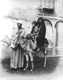 Click to see details of a veiled woman and a child on a donkey...