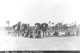 Click to see details of a group of men with camels.
