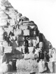 Click to see details of tourists climbing the pyramid of...